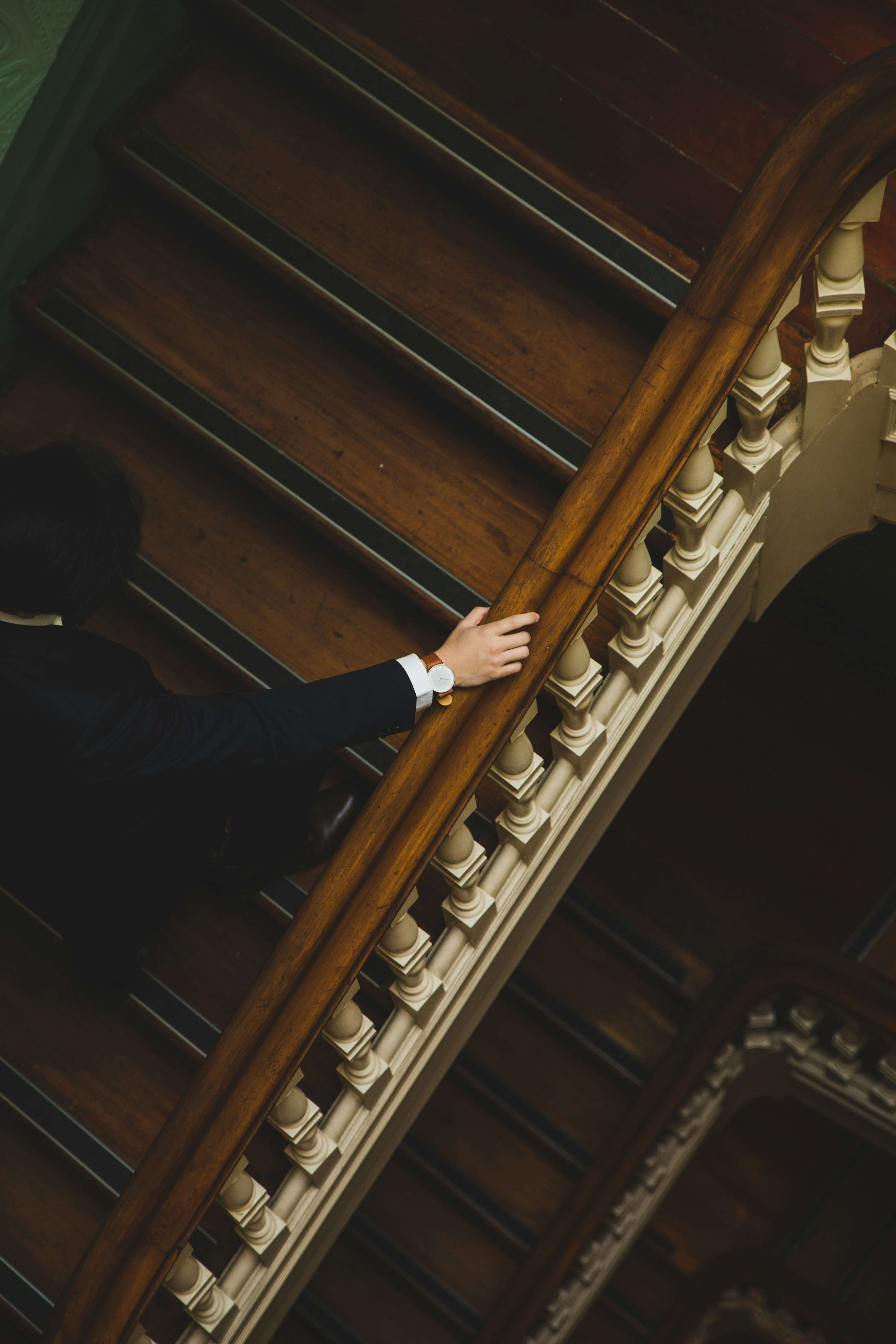 Business professional ascending a staircase